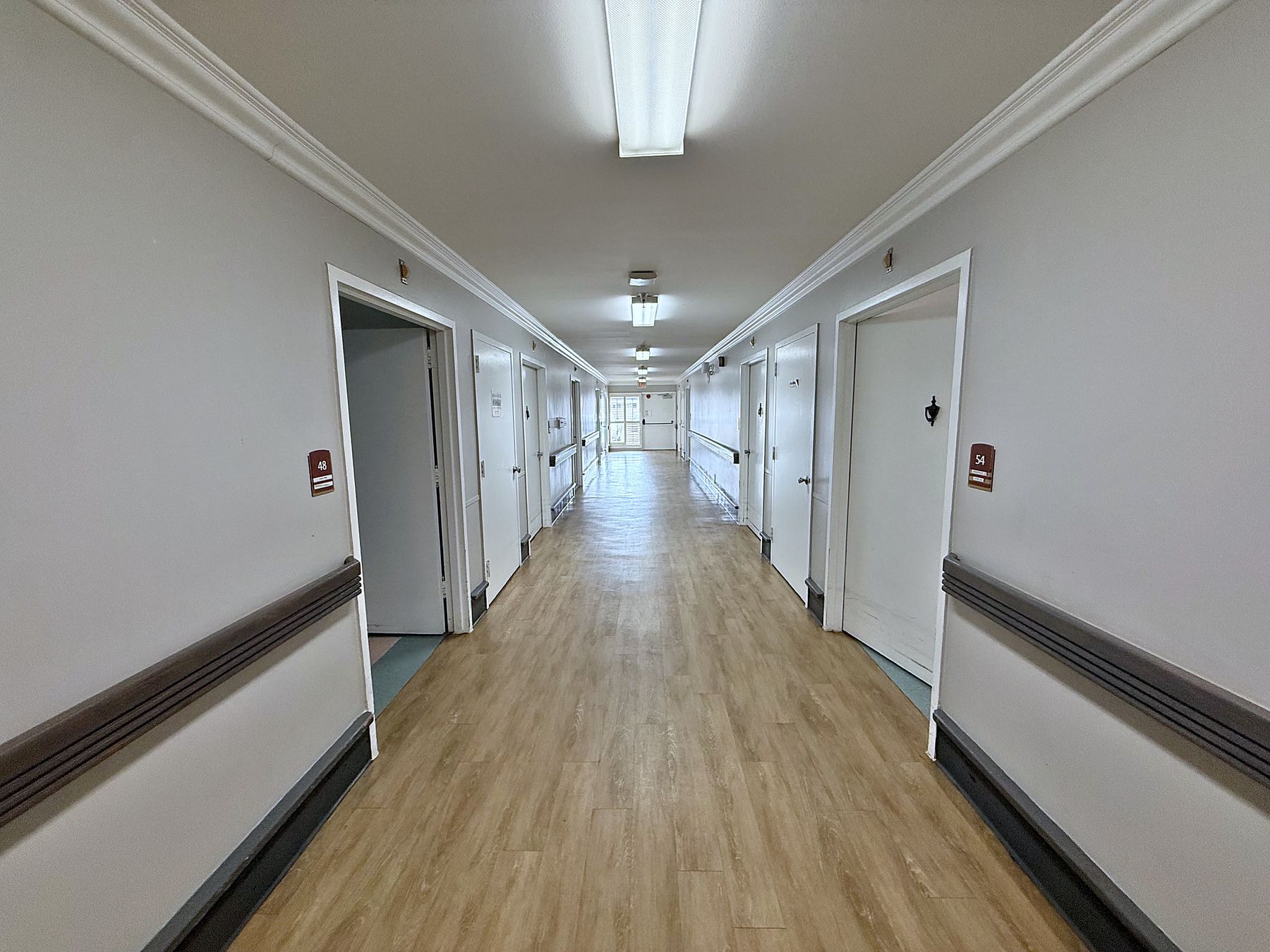 Wide, bright hallways with handrails throughout